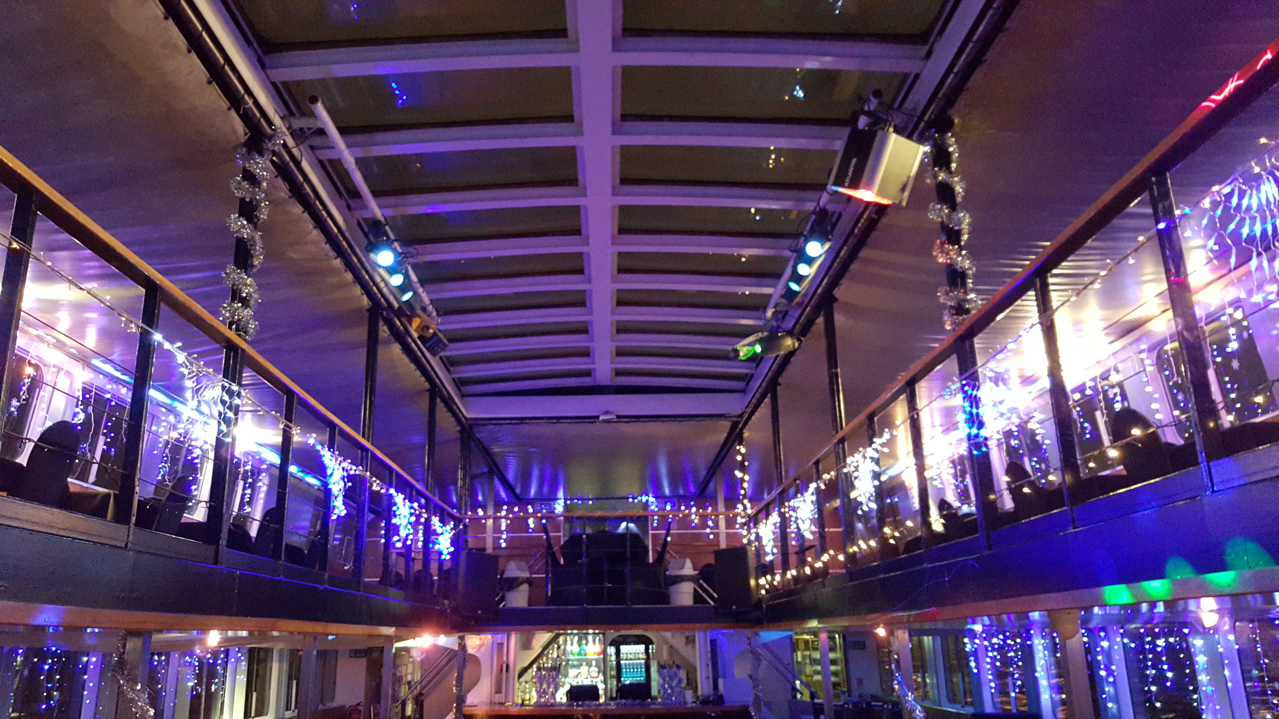 Enjoy party hits from the DJ on the NYE Thames cruise